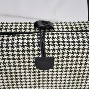 KONA CAVE® luxury Travel Dog Bed for restaurants in  Black and White Houndstooth with Black Quilted Alcantara faux suede lining.  Keeps pets safe and calm in restaurants and pubs. 
