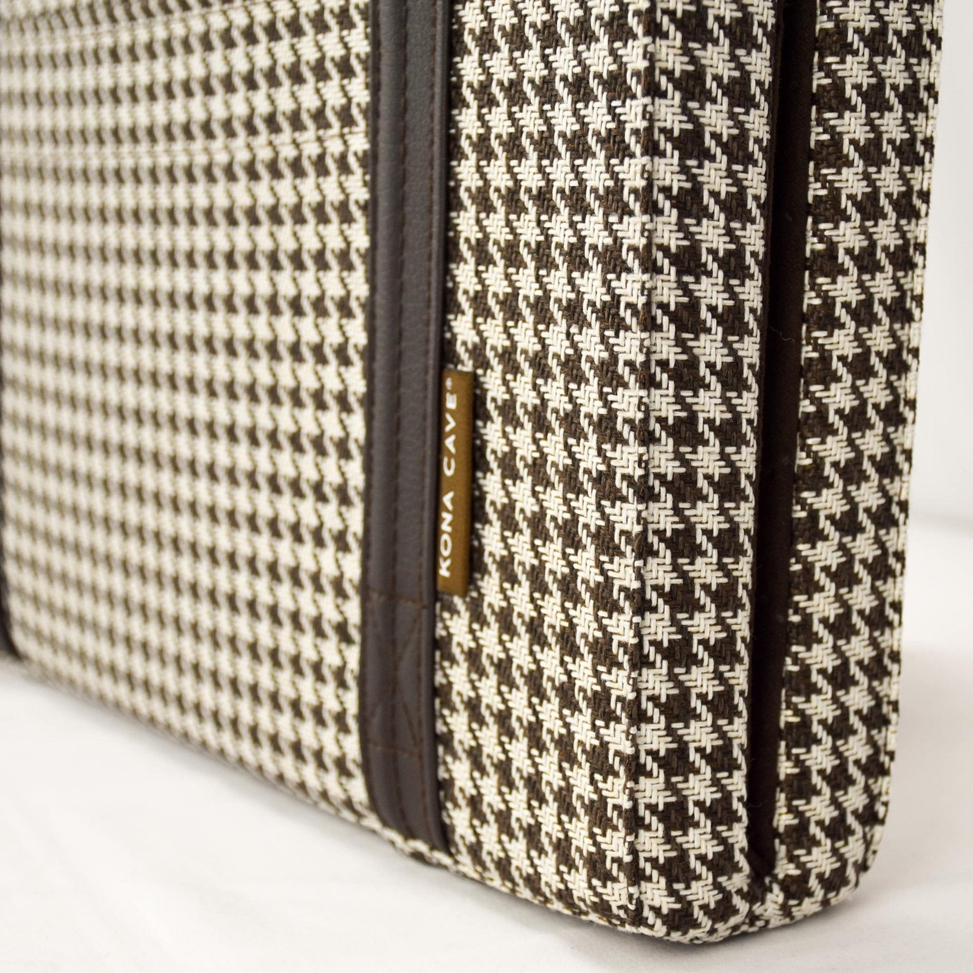 Close up of brown and white Houndstooth Travel Dog Bed by KONA CAVE®.  Folded,  portable dog bed in brown.