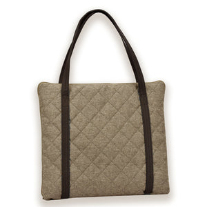 Travel dog bed. Portable dog bed. Folded, zips closed. Carried by long shoulder straps, handles. Ideal for restaurants. Beige back