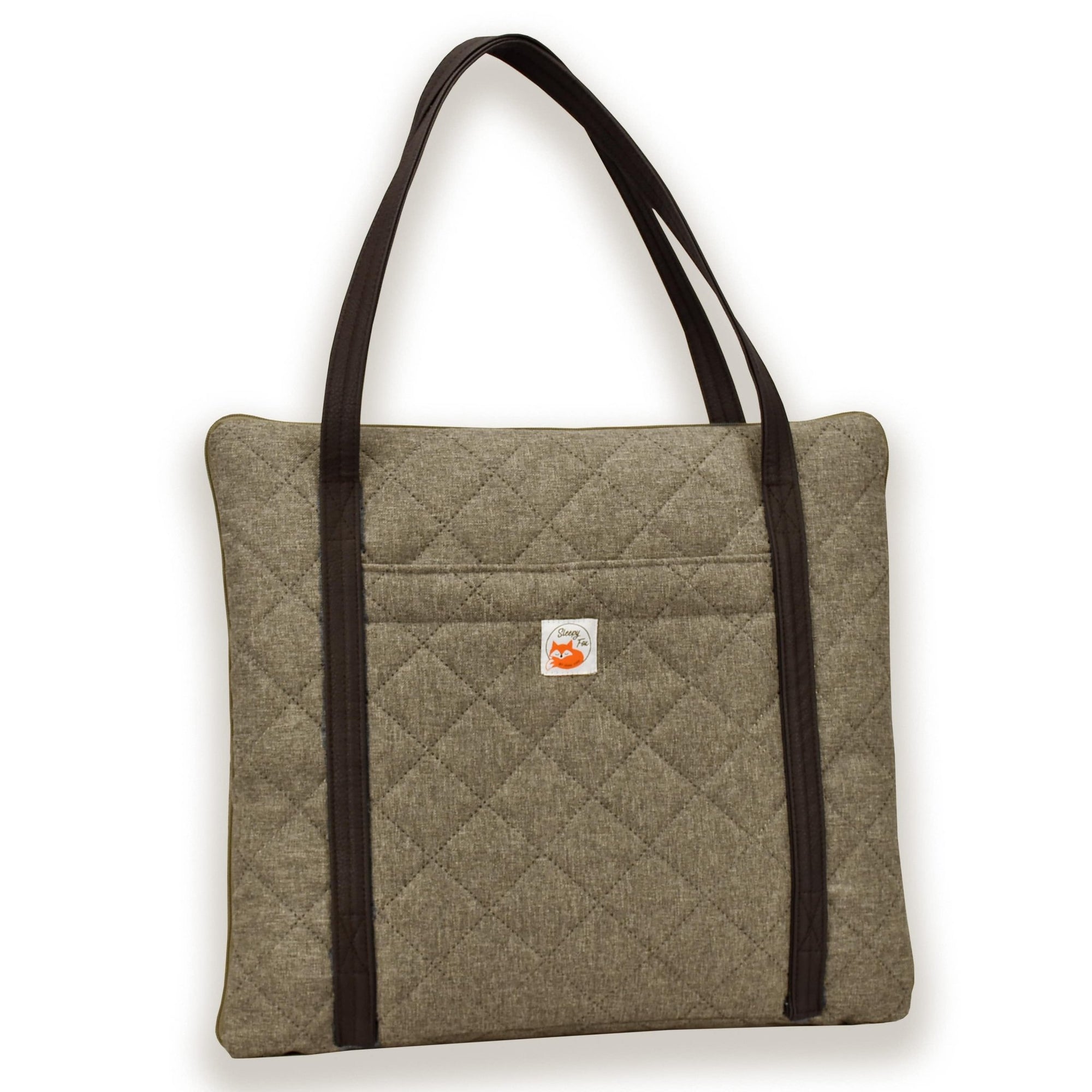 Travel dog bed. Portable dog bed. Folded, zips closed. Carried by long shoulder straps, handles. Ideal for restaurants. Beige 