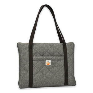 Travel dog bed. Portable dog bed. Folded, zips closed. Carried by long shoulder straps, handles. Ideal for restaurants. Grey