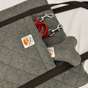 Restaurant dog bed. Portable dog bed. Folded, zips closed. Carried by long shoulder straps, handles. Ideal for restaurants with pocket.  