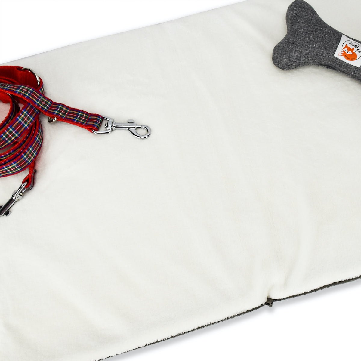 Restaurant dog bed. Portable dog bed. Folded, zips closed. Carried by long shoulder straps, handles. Ideal for restaurants. Soft fleece lining