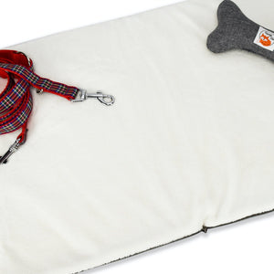 Restaurant dog bed. Portable dog bed. Folded, zips closed. Carried by long shoulder straps, handles. Ideal for restaurants. Soft fleece lining
