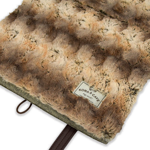 KONA CAVE® Luxury Travel Dog Bed in Faux Chinchilla Fur.  Folded, portable dog bed for restaurants and travel.  Luxury dog mat with shoulder straps to make it easy to carry the dog bed. 