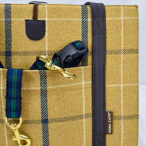 Tartan collar and leash inside the front pocket of the KONA CAVE® Travel Dog Bed in Gold Country Plaid with Shearling Wool Lining