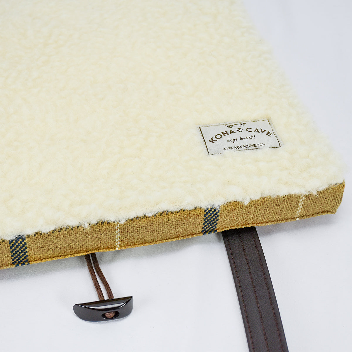 KONA CAVE® Folded Travel Dog Bed for restaurants, cars, pubs and hotels.  100% real shearling wool lining in the inside of the KONA CAVE® Travel Dog Bed in Gold Country Plaid helps regulate temperature
