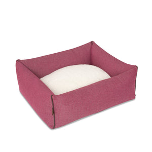 KONA CAVE® designer bolster dog bed in elegant pink herringbone fabric with leather trim.