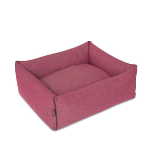 KONA CAVE® designer bolster dog bed in elegant pink herringbone fabric with leather trim.